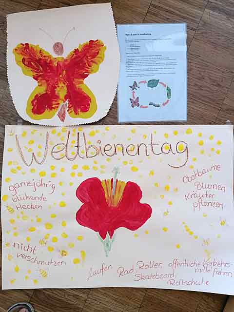 Ein Plakat und eine Anleitung zum Weltbienentag